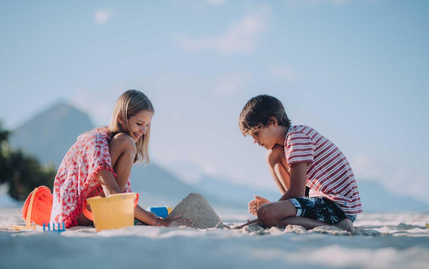 Children playing in the sand on Flic en Flac beach